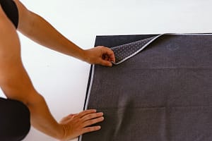 yoga towel folded corner on yoga mat